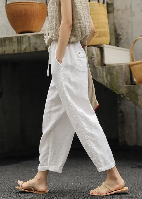 Side view of white cotton drawstring pants