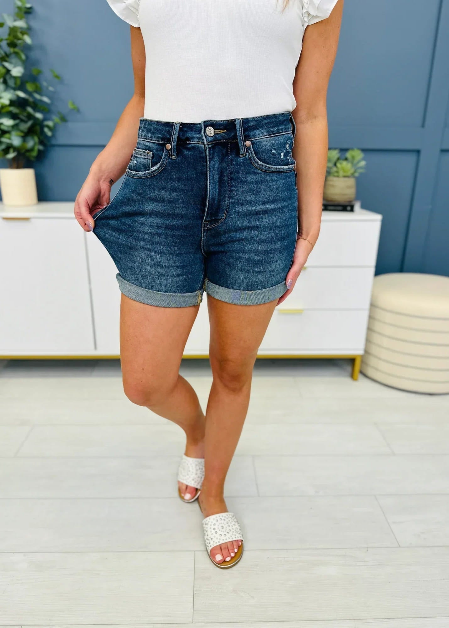 Front view of rolled cuff denim shorts