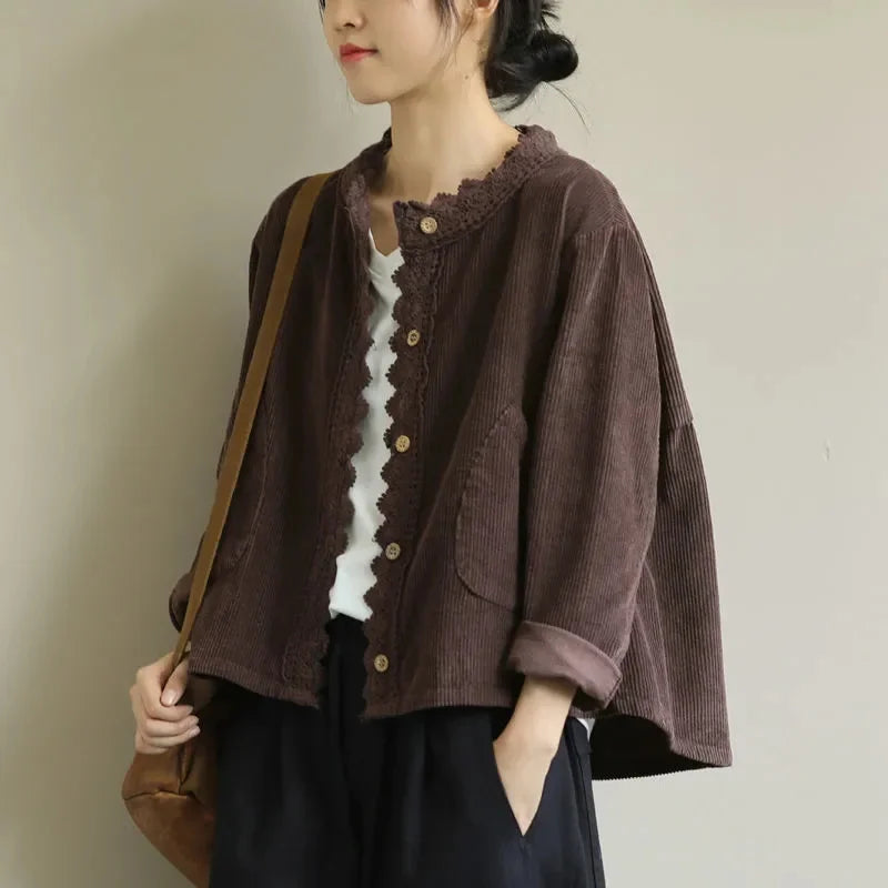 Side view of a cropped brown lace jacket